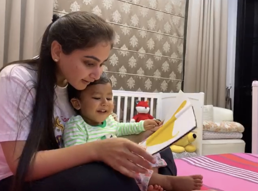 Toddler and mom enjoying a book